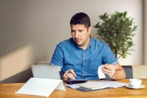 Small business owner planning service packages, pricing options, and bundled services for customers.